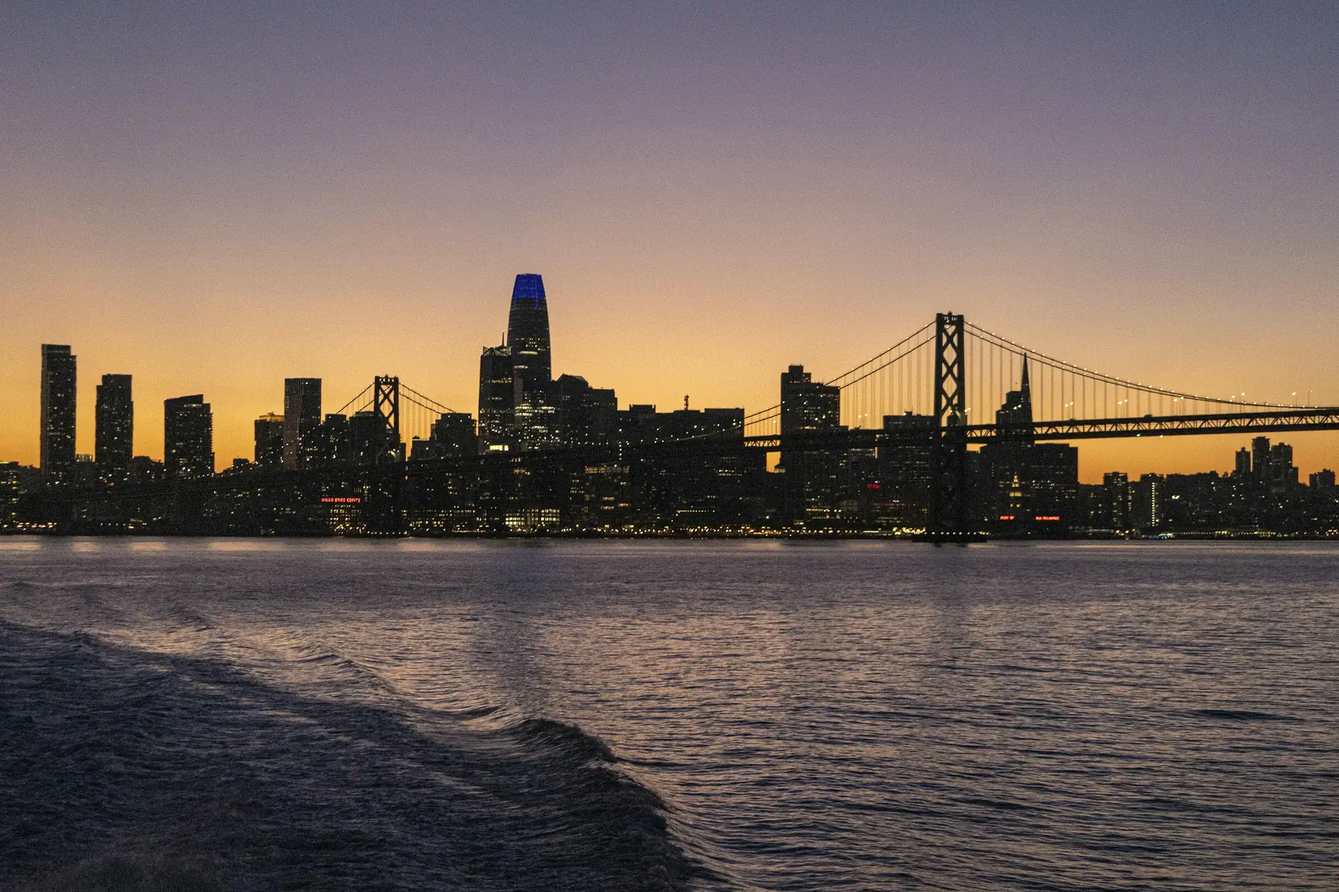 The San Francisco skyline and the Bay Bridge at dusk